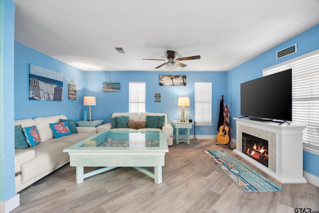 220 Pin Oak Dr, Mabank, TX 75156 - living area with ceiling fan, wood finished floors, and a glass covered fireplace