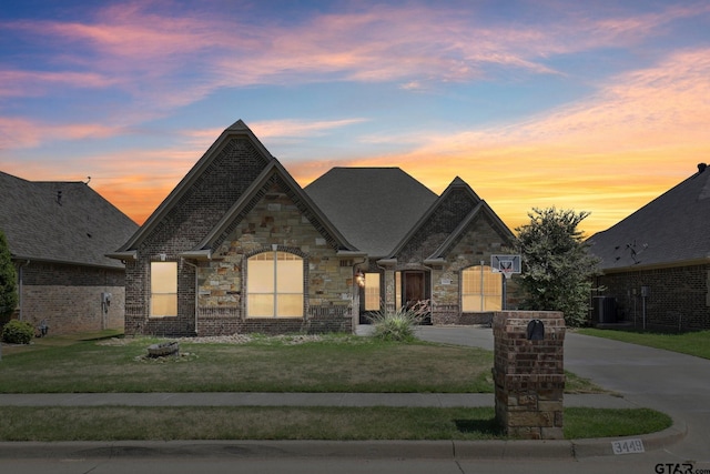 3449 Abes Landing Dr, Granbury, TX 76049 - french country home with a front yard and stone siding