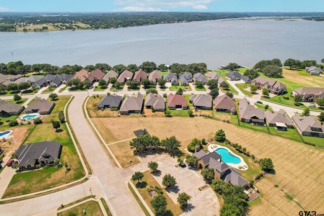3449 Abes Landing Dr, Granbury, TX 76049 - aerial perspective of suburban area featuring a pool and a large body of water