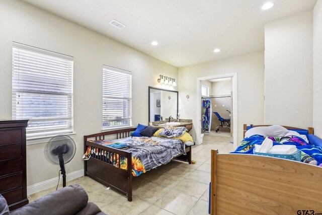 3449 Abes Landing Dr, Granbury, TX 76049 - bedroom with recessed lighting, light tile patterned floors, and a walk in closet