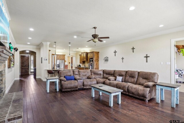 3449 Abes Landing Dr, Granbury, TX 76049 - living area with a ceiling fan, recessed lighting, dark wood-type flooring, arched walkways, and crown molding