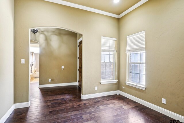 3449 Abes Landing Dr, Granbury, TX 76049 - unfurnished room featuring arched walkways, hardwood / wood-style floors, and crown molding