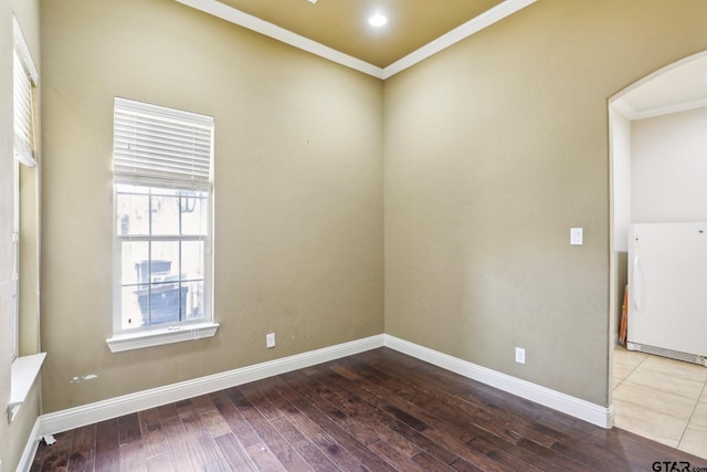 3449 Abes Landing Dr, Granbury, TX 76049 - empty room with crown molding, hardwood / wood-style floors, and arched walkways
