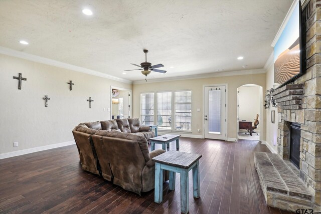 3449 Abes Landing Dr, Granbury, TX 76049 - living area with a ceiling fan, arched walkways, dark wood-type flooring, a fireplace, and recessed lighting