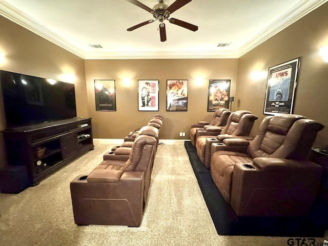 cinema with crown molding, carpet floors, and ceiling fan