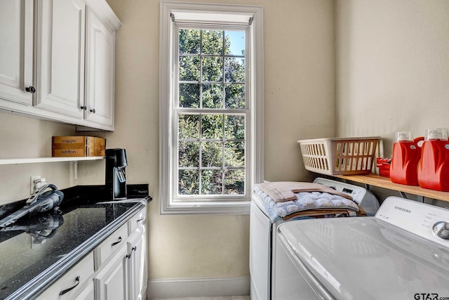 laundry room with cabinets, independent washer and dryer, and a healthy amount of sunlight