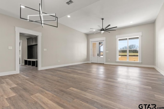 unfurnished living room with baseboards, visible vents, wood finished floors, and recessed lighting