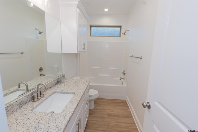 full bathroom with vanity, wood-type flooring,  shower combination, and toilet