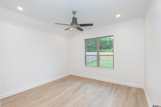 spare room featuring ceiling fan, crown molding, and light hardwood / wood-style flooring