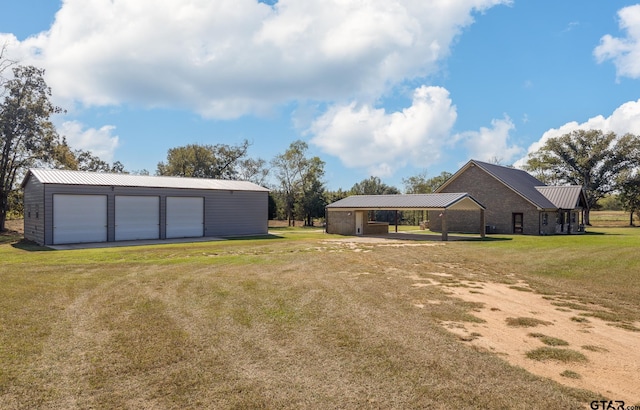 view of yard with an outbuilding and a garage