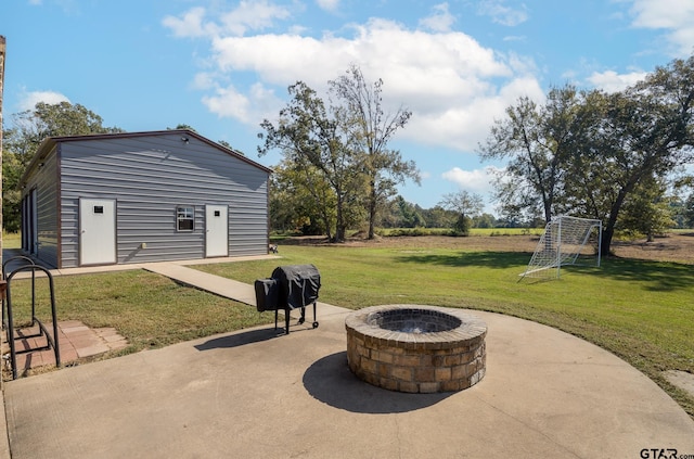 view of patio / terrace featuring an outdoor fire pit