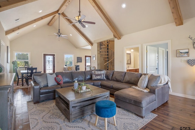 living room featuring beamed ceiling, ceiling fan, wood-type flooring, and high vaulted ceiling