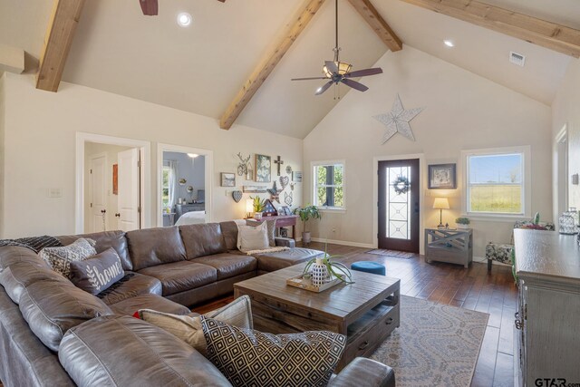 living room with ceiling fan, dark hardwood / wood-style floors, and plenty of natural light