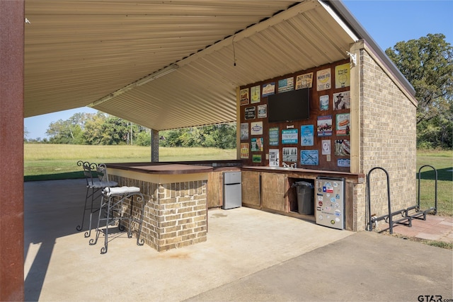 view of patio / terrace featuring exterior bar