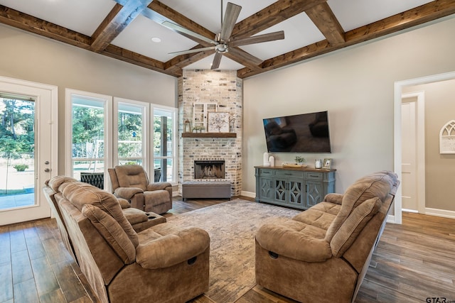 living room with beam ceiling, coffered ceiling, hardwood / wood-style flooring, and a fireplace