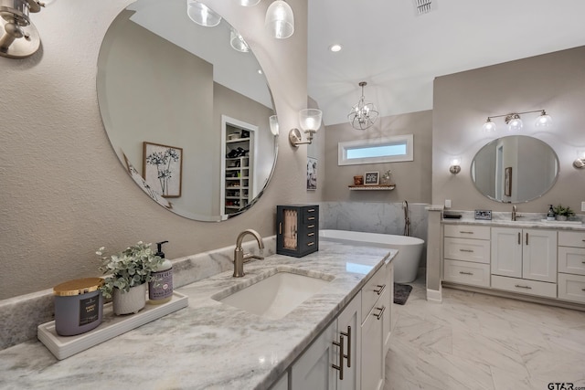 bathroom featuring vanity and a bathing tub