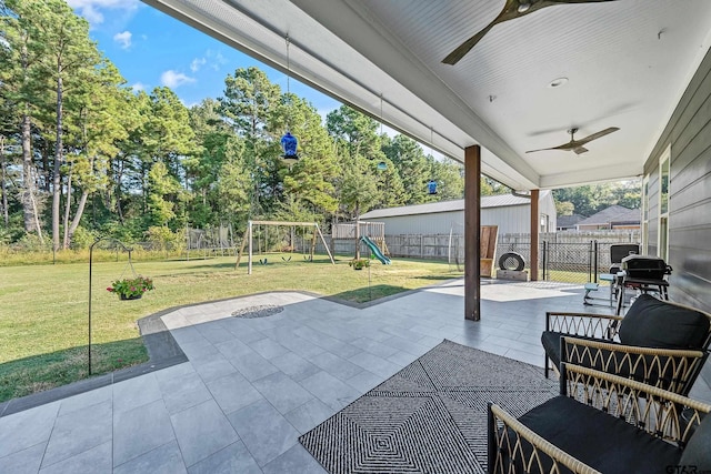 view of patio / terrace with a playground and ceiling fan