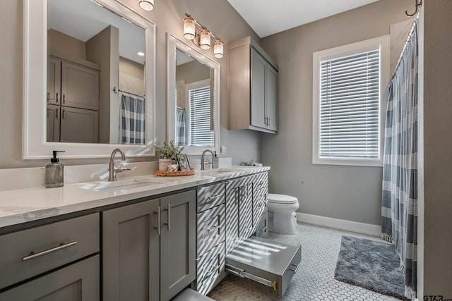 bathroom featuring a shower with curtain, tile patterned floors, vanity, and toilet