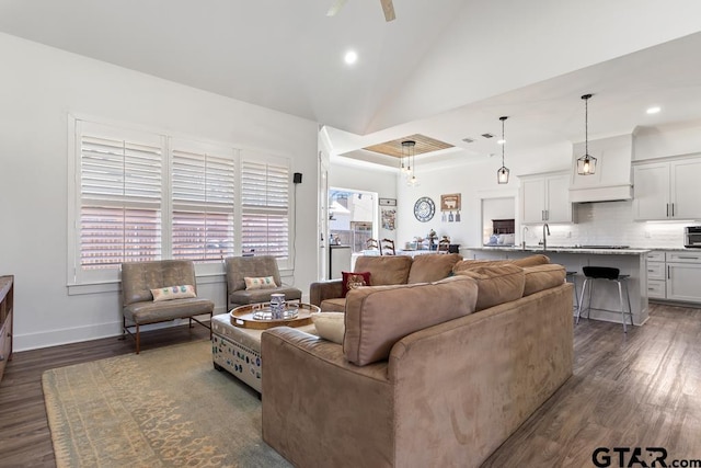 living room with recessed lighting, dark wood-style floors, and baseboards