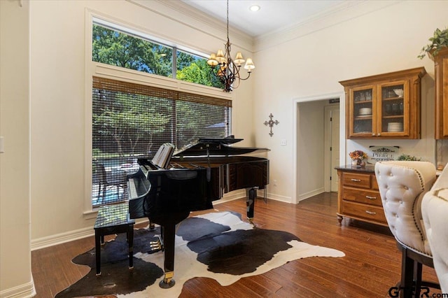 909 Univerity Dr, Carthage, TX 75633 - living area with healthy amount of natural light, ornamental molding, baseboards, a chandelier, and a high ceiling