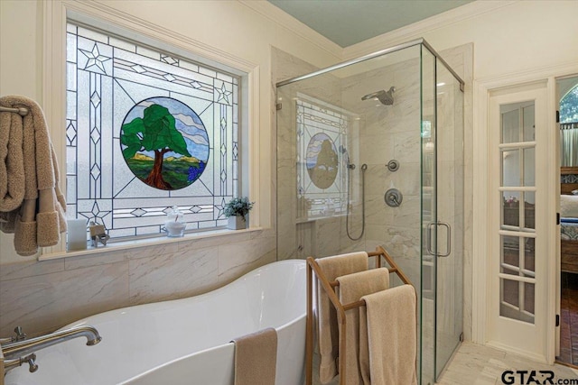 909 Univerity Dr, Carthage, TX 75633 - bathroom with a freestanding tub, crown molding, a shower stall, and healthy amount of natural light