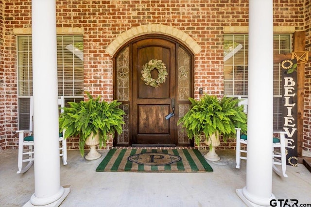 909 Univerity Dr, Carthage, TX 75633 - view of exterior entry featuring brick siding
