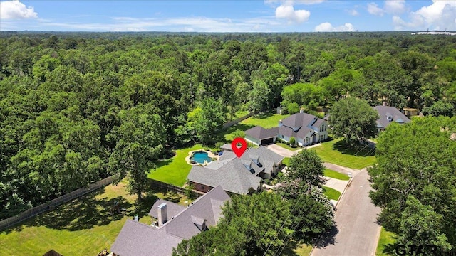 909 Univerity Dr, Carthage, TX 75633 - bird's eye view of a forest and a pool area