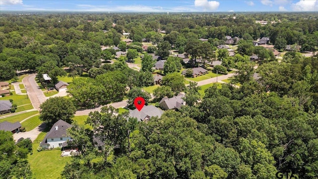 909 Univerity Dr, Carthage, TX 75633 - aerial view of residential area featuring a forest