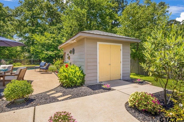 909 Univerity Dr, Carthage, TX 75633 - view of shed with a fenced backyard