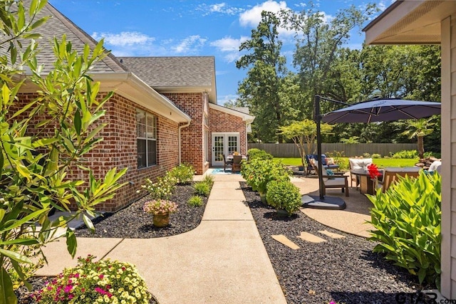 909 Univerity Dr, Carthage, TX 75633 - view of yard featuring a patio and french doors