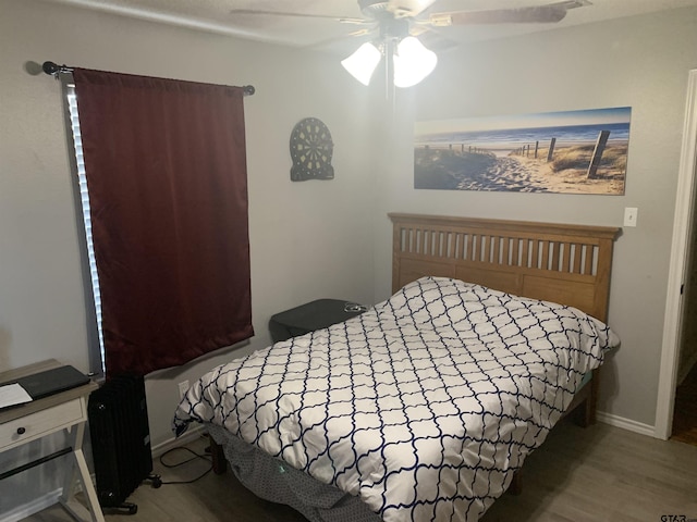 bedroom featuring ceiling fan and light wood-type flooring