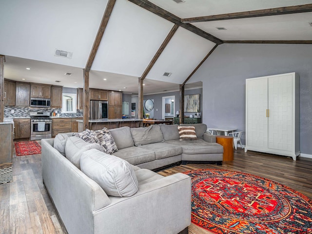 living room featuring beamed ceiling, dark hardwood / wood-style floors, and high vaulted ceiling