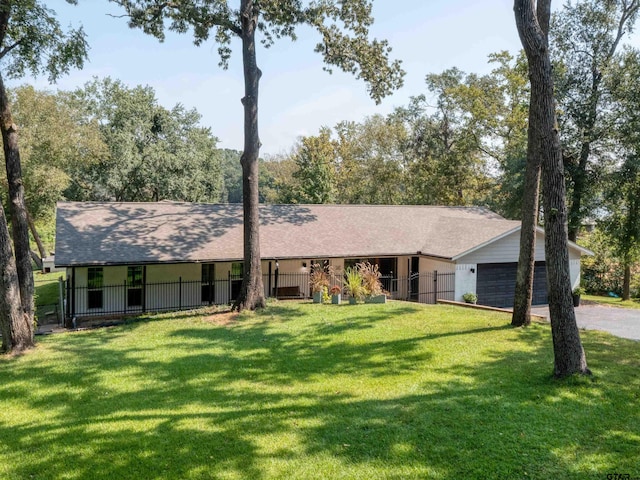 ranch-style house with a front lawn and a garage