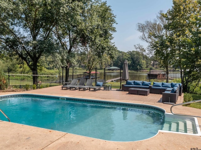 view of pool featuring an outdoor living space and a patio