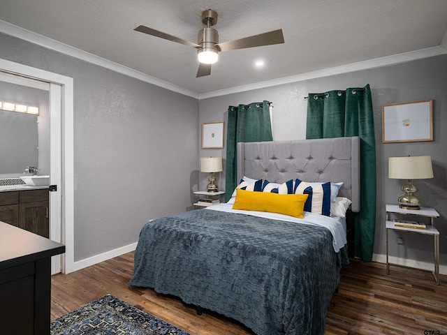 bedroom with ensuite bath, ceiling fan, a textured ceiling, crown molding, and dark wood-type flooring