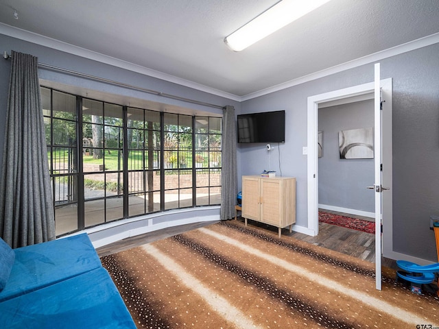 interior space featuring ornamental molding and hardwood / wood-style floors