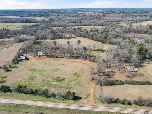 birds eye view of property with a rural view