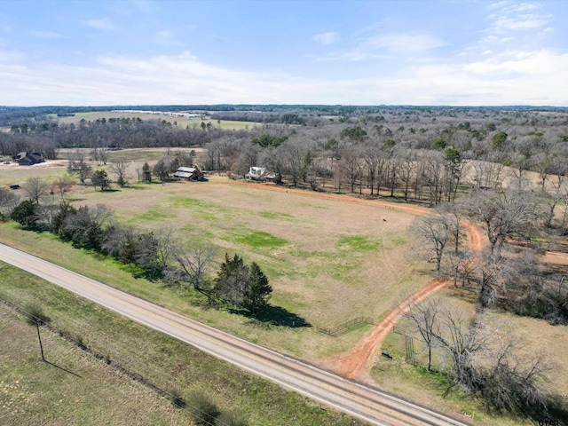 birds eye view of property with a rural view