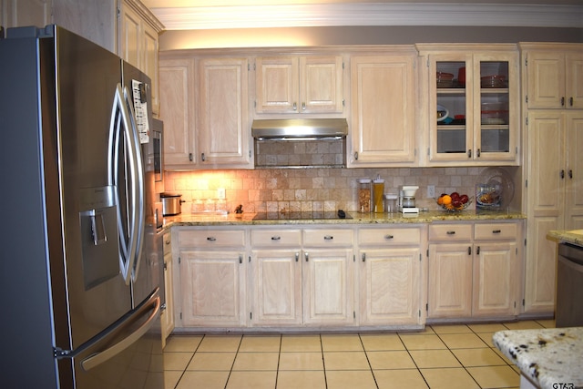 kitchen featuring decorative backsplash, appliances with stainless steel finishes, light tile patterned flooring, and range hood