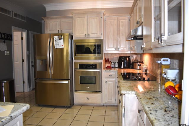 kitchen with light stone counters, appliances with stainless steel finishes, light tile patterned floors, backsplash, and crown molding