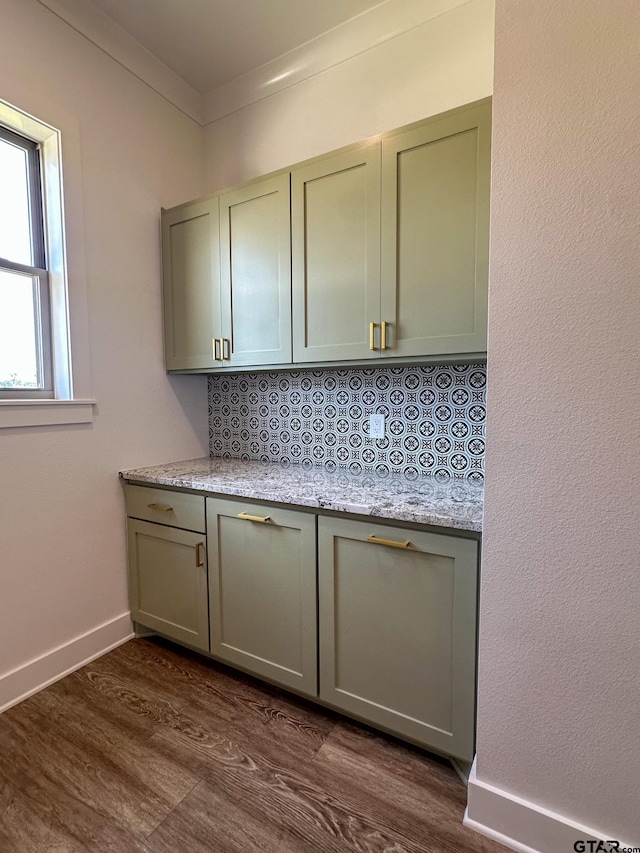 12301 Harlon, Flint, TX 75762 - kitchen with gray cabinetry, crown molding, dark wood-style floors, light stone countertops, and decorative backsplash