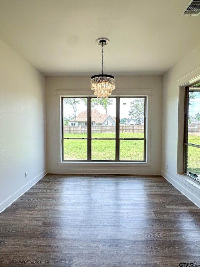 12301 Harlon, Flint, TX 75762 - unfurnished dining area featuring a chandelier and dark wood-style floors