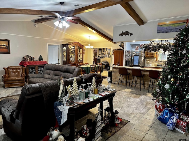 living room with ceiling fan with notable chandelier, lofted ceiling with beams, and sink