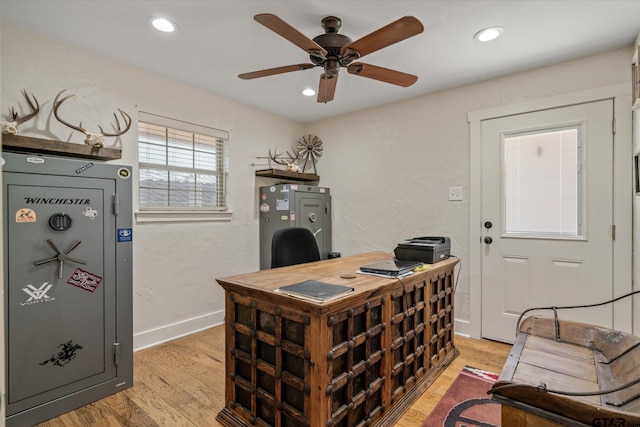 office area with ceiling fan and light hardwood / wood-style floors