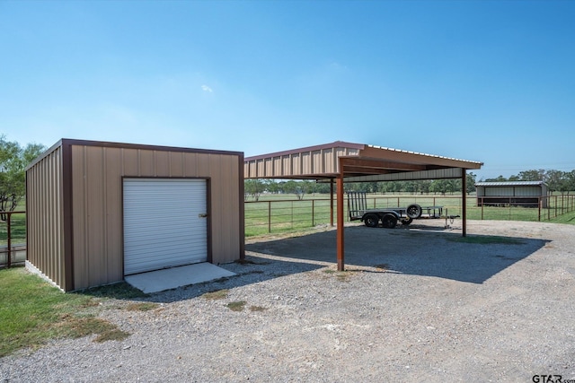 view of vehicle parking featuring a garage