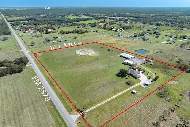 birds eye view of property with a rural view