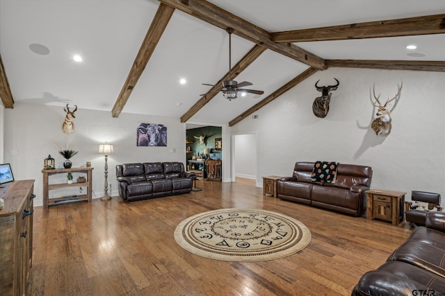 living room with lofted ceiling with beams, hardwood / wood-style floors, and ceiling fan