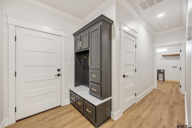 mudroom featuring ornamental molding and light hardwood / wood-style floors