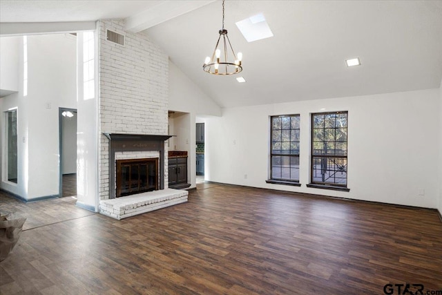 unfurnished living room with high vaulted ceiling, wood finished floors, an inviting chandelier, a brick fireplace, and beam ceiling