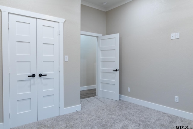 unfurnished bedroom with carpet flooring and a closet